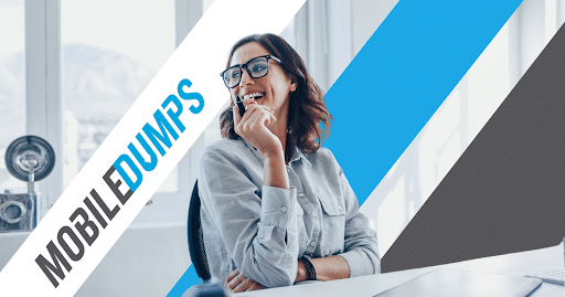 Smiling woman in a modern office, wearing glasses and holding a pen, with Mobiledumps branding and diagonal stripes in white, blue, and gray.